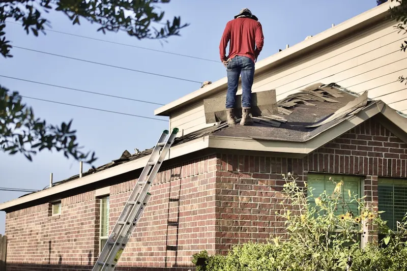 Professional roofer working on a residential roof in East Anaheim